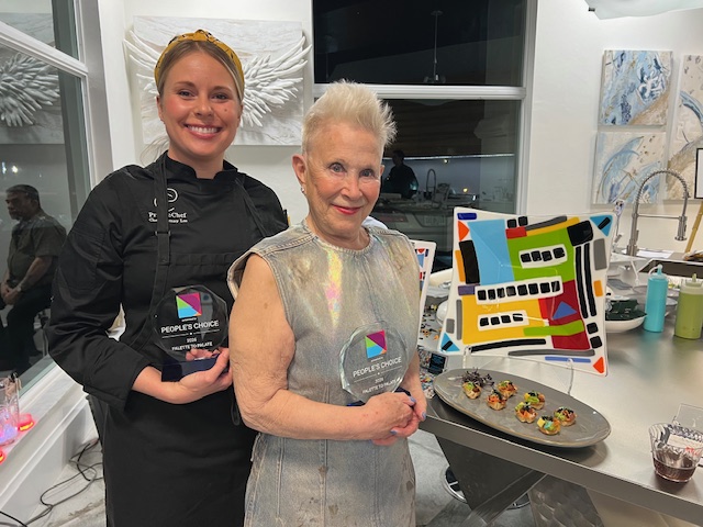 Bonnie Ziskin with her People's Choice award and colorful fused glass work